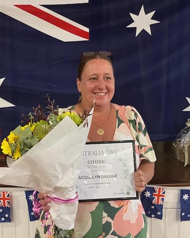 Jacquie Dredge holding her Citizen of the Year certificate